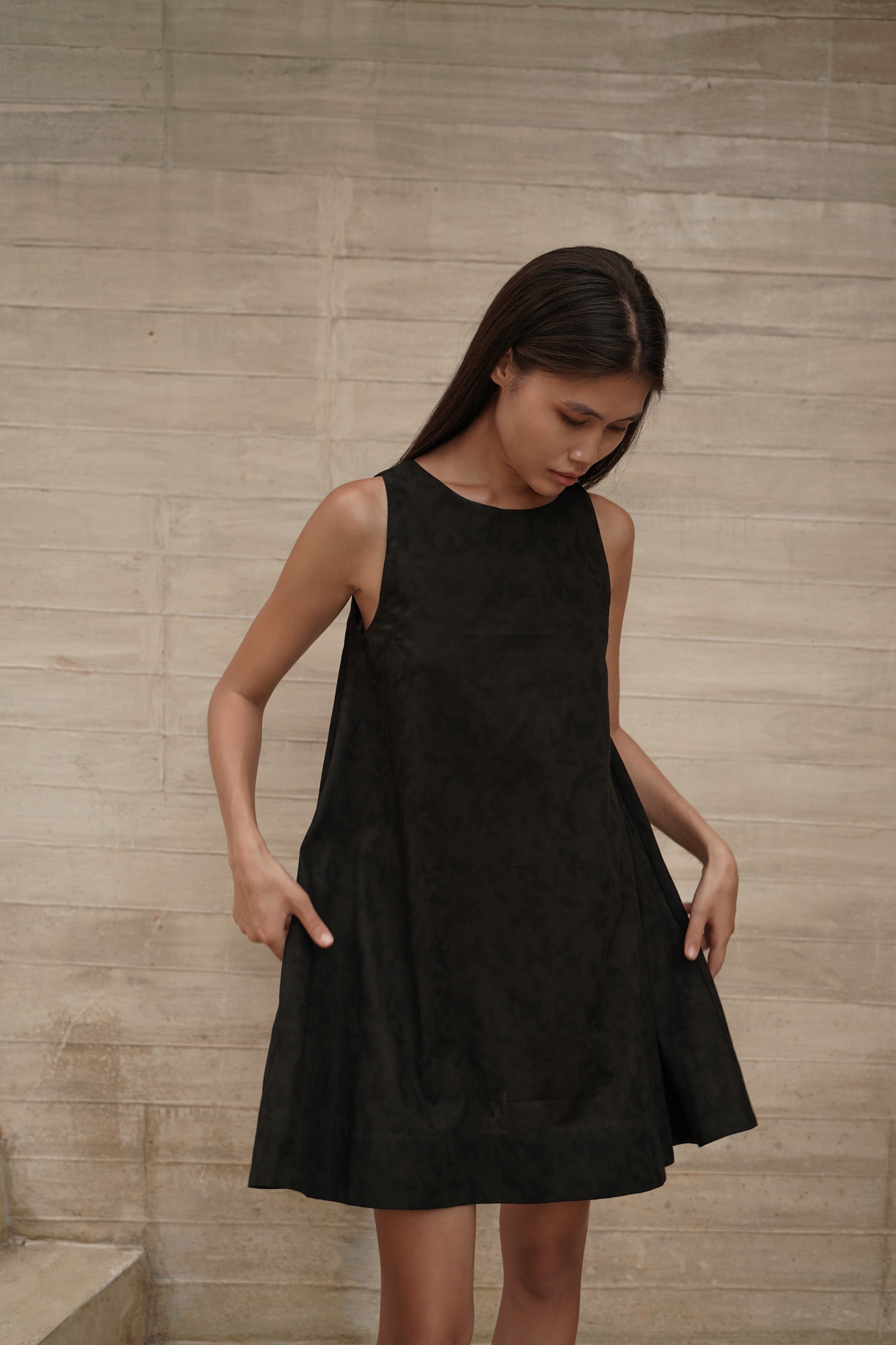 Trapeze Jacquard Dress – front, hands on dress