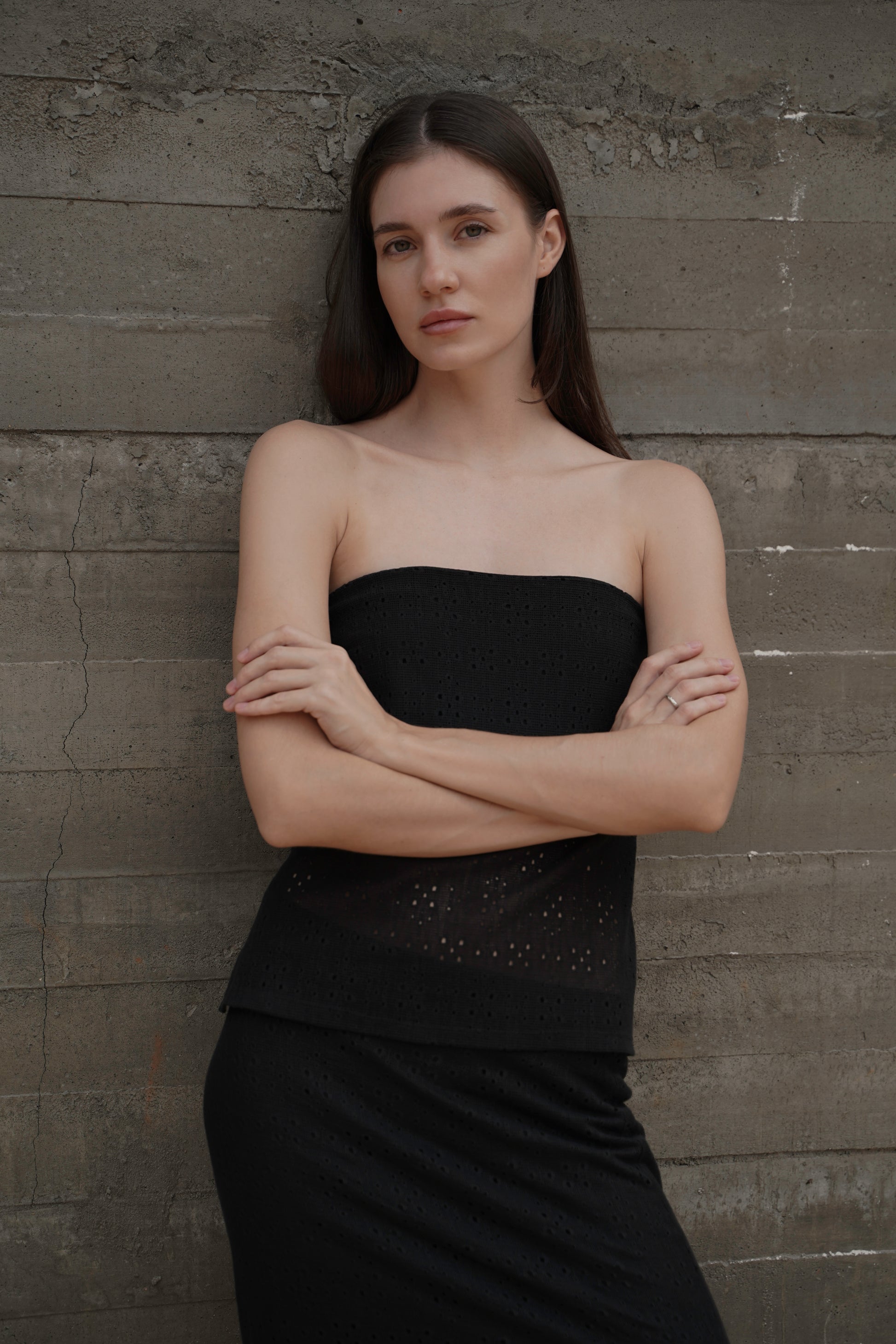 Bandeau Top Lace — front view, model against concrete wall