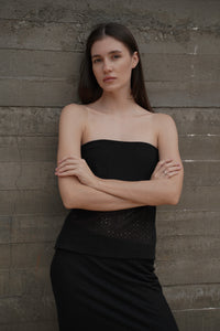 Bandeau Top Lace — front view, model against concrete wall